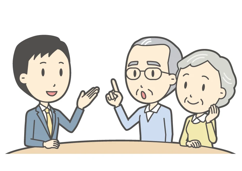 担当者が年配の夫婦の相談にのるイラスト