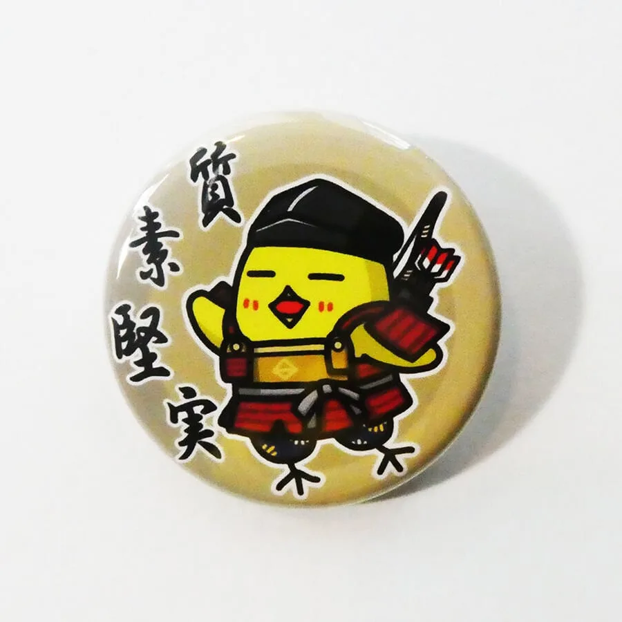 弓を背負ったひよこが描かれた缶バッジ